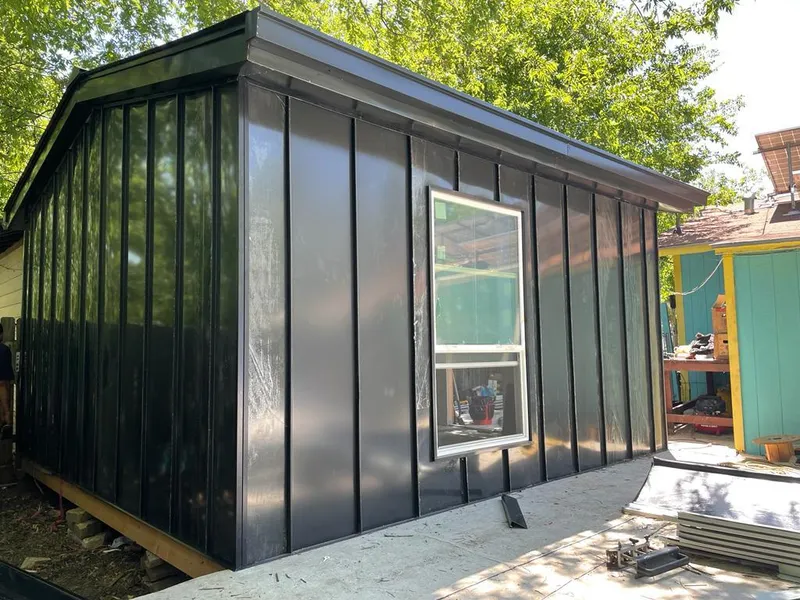 Black standing seam metal wall panels for Roof Inspection in West Earl